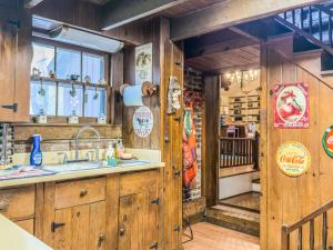a kitchen with wooden cabinets and a sink at A Charming Nature Retreat in Greensboro
