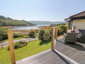 a balcony with a view of a river at Allt An Dorran in Acharacle