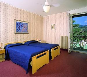 Ένα ή περισσότερα κρεβάτια σε δωμάτιο στο Hotel Terminus