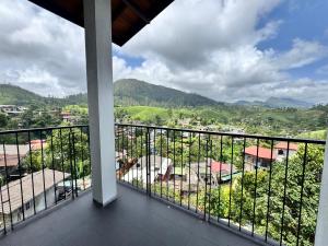 a balcony with a view of a city at Prabhaz grand villa in Hatton