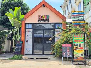 a fast food restaurant on the side of a street at The Funky Village in Siem Reap