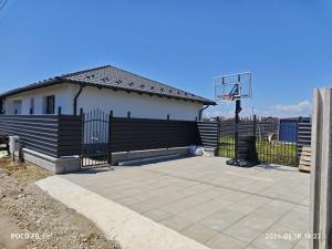 a basketball hoop in front of a house at Ola's House in Bradu