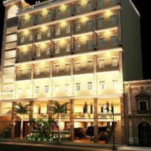 a large white building with lights on it at RUBY HOTEL in Cà Mau