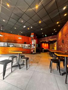 a restaurant with tables and chairs in a room at Urban City Centre Hostel in Brussels +20 photos