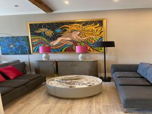 a living room with a couch and a table at Modern Suite in the Taunus in Bad Camberg