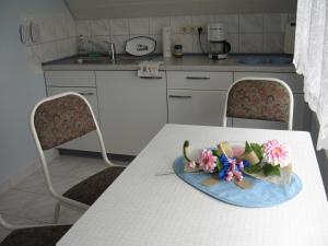 a table with a plate with a cake on it at Tor zum Darss in Pruchten
