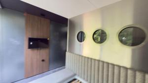 a hallway with two mirrors on the wall at Floatel Vilnius in Vilnius