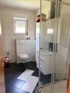a bathroom with a toilet and a sink at Sobe DANA Banja Vrućica in Teslić