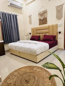 a bedroom with a large bed in a room at Ashirwad Stay in Rishīkesh +13 photos