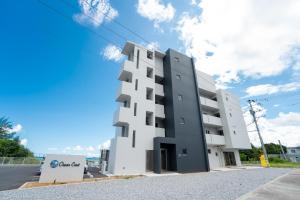 a white building on the side of a street at Ocean Front! New Built Apartment! SOU Resort YAKA in Kin