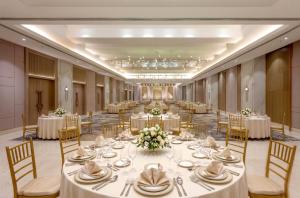 a large banquet room with tables and chairs at Hotel Express Inn Heritage Aurangabad Airport in Aurangabad +122 photos