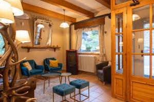 a living room with chairs and a table at Mont Velan Chambres & Restaurant in Saint-Oyen +79 photos