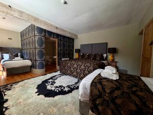 a hotel room with two beds and a mirror at Bellinter House Hotel & Spa in Navan +52 photos