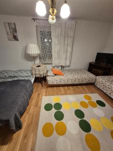 a living room with a couch and a rug at Nocleg na działce w miasteczku in Kock