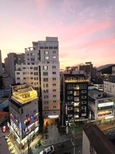 a view of a city skyline with buildings at Geoje Residence Hotel in Geoje