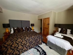 a hotel room with two beds in a room at Bellinter House Hotel & Spa in Navan
