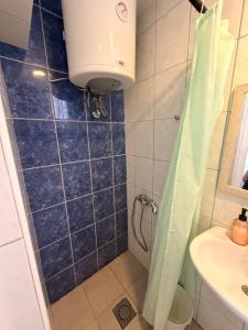 a bathroom with a shower and a sink at IN Villa Guesthouse in Sutomore +45 photos