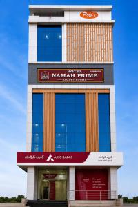 a large building with a sign on it at Hotel Namah Prime Near By Chanda Nagar Ameenpur Road in Hyderabad
