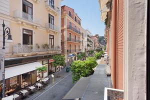 an empty street in a city with buildings at Sorrentina Guest House in Sorrento