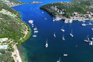 an aerial view of a group of boats in a harbor at Villa Amoudia - Luxury Villa right on the beach with Private Pool in Sivota