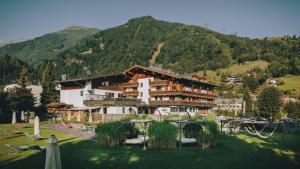 a large building in front of a mountain at CORE Kaprun in Kaprun