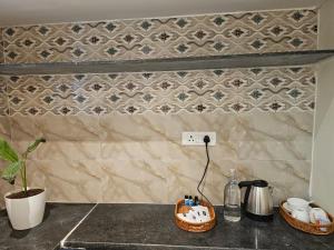a kitchen counter top with a counter top with a counter top at Hotel Ferro in Kumbalgod +66 photos