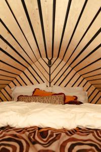a bedroom with a bed in a yurt at Gorgeous Stylish Home Near Longleat and Bath with Private Heated Pool and Sauna in Corsley +7 photos