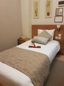 Postel nebo postele na pokoji v ubytování Glaros Hotel