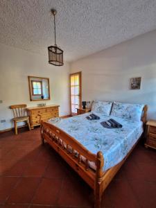 a bedroom with a bed and a desk and a sink at Il Posticino del Lago di Como in Esino Lario