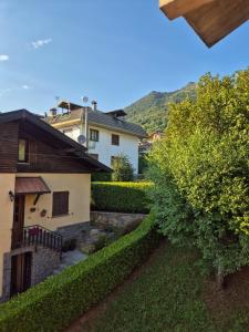 a view of a house from the garden at Il Posticino del Lago di Como in Esino Lario