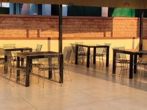 a group of tables and chairs in a room at Hotel Gajender Niwas Sun City A Boutique Stay in Jodhpur
