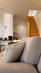 a living room with two pillows on a couch at Ribeirinha Guesthouse in Guarda