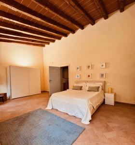a bedroom with a large bed in a room at Villa I Bossi in Arezzo +121 photos