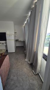 a long line of curtains in a room at Sinai st in Eilat