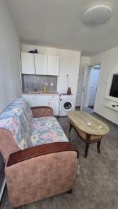 a living room with a couch and a table at Sinai st in Eilat