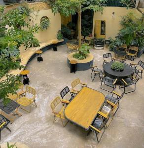 an overhead view of a patio with a wooden table and chairs at Tuệ Tĩnh Hotel in Hải Dương