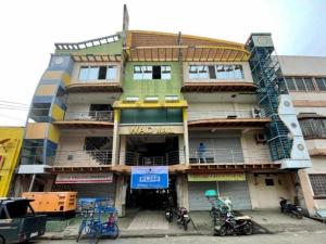a building with bikes parked in front of it at Hotel Benjamin Naval in Biliran