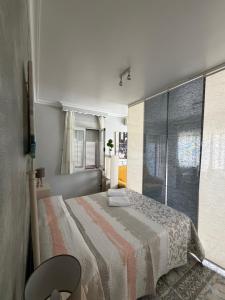 a bedroom with a bed and a window at Apartamento turístico ilusiones 5 in Cazalla de la Sierra