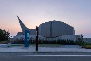 a large building with a sign in front of it at KAMOME SLOW HOTEL the COMPACT in Awaji