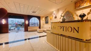 a lobby of a hotel with a reception sign at Hotel janki elite in Jaipur
