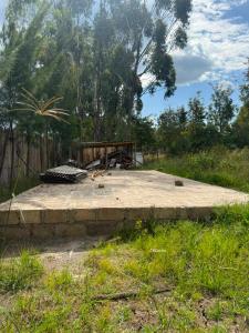 a large concrete area in the middle of a field at Serenity Glamping By Rafiki in Nanyuki