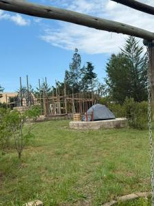 a tent in the middle of a yard at Serenity Glamping By Rafiki in Nanyuki