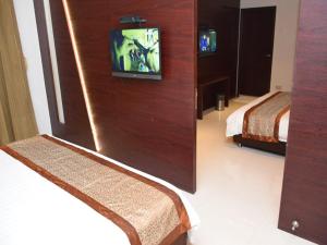 Voodi või voodid majutusasutuse Hotel Sai Jashan Shirdi - Where blessings & comfort meet toas