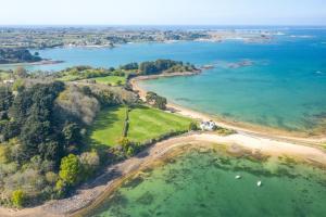 an aerial view of a beach and the ocean at Le port in Perros-Guirec +14 photos
