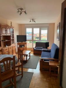 a living room with a couch and a chair at Atalaya 5 - VUT5463AS in Ribadesella