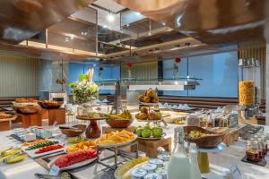 a buffet line with many different types of food at Pan Pacific Suites Nairobi in Nairobi