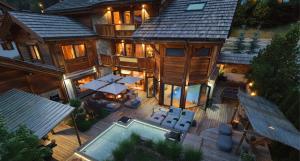 an aerial view of a house with a pool at Chalet ORPIN Serre-Chevalier piscine cinéma sauna in Le Monêtier-les-Bains