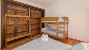 a bedroom with two bunk beds and two pairs of shoes at Villa Andrea Comares in Comares +31 photos