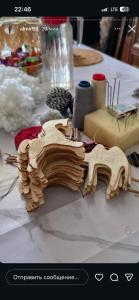 a wooden train on top of a table at Ademi Art in Kyzart
