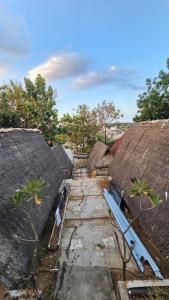 an aerial view of a group of buildings with roofs at My Backpacker House in Gili Trawangan